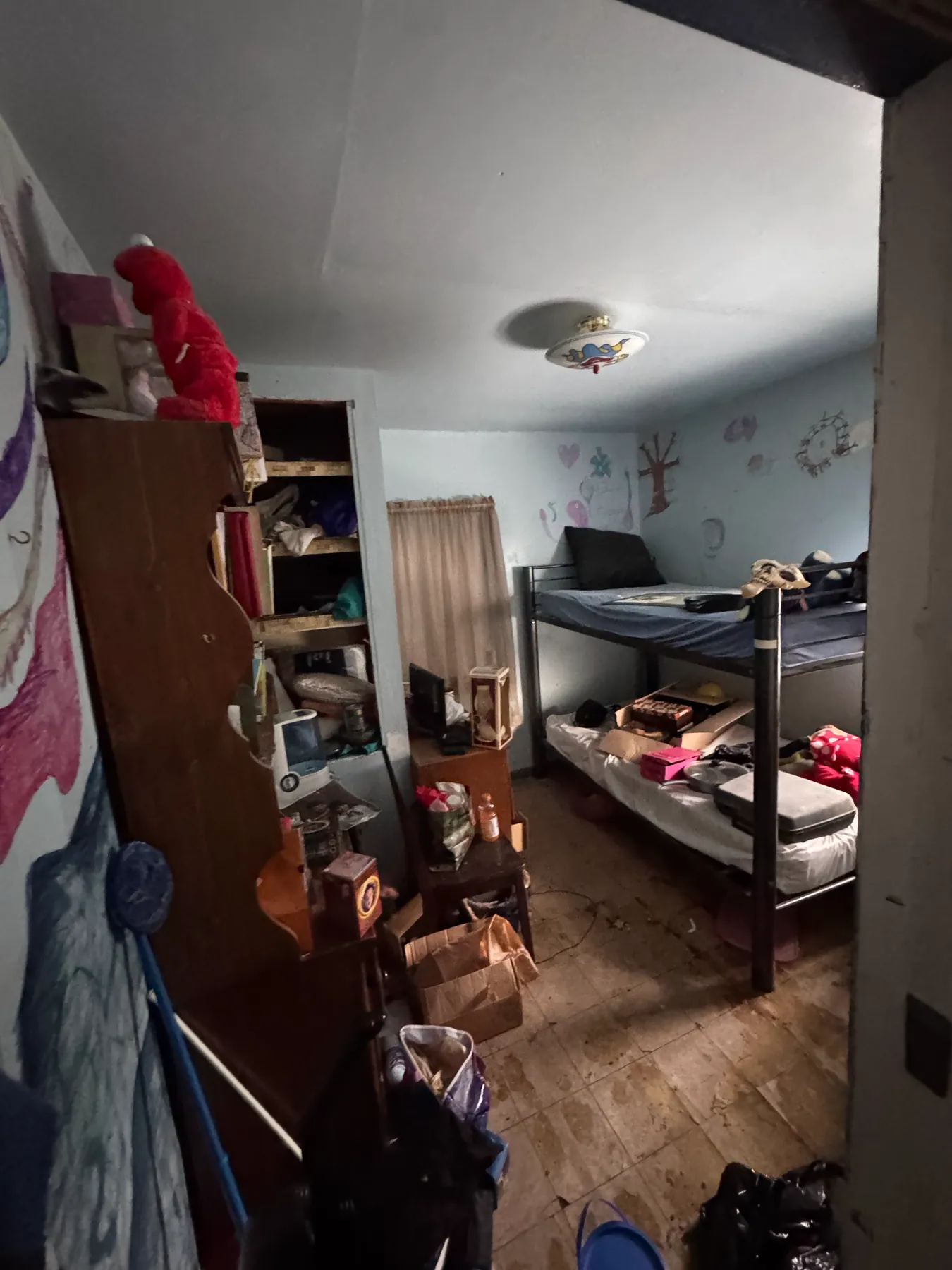 Bedroom cleanout with wall mural — before
